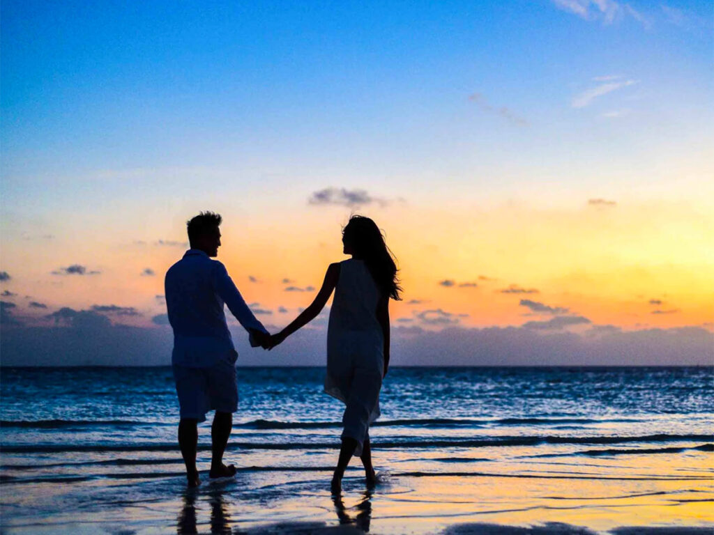 Couple on Beach_Asad_Pexels